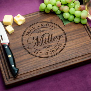 walnut cutting board custom engraving with grapes cheese glass of white wine