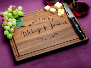 walnut cutting board custom engraving with grapes cheese glass of red wine