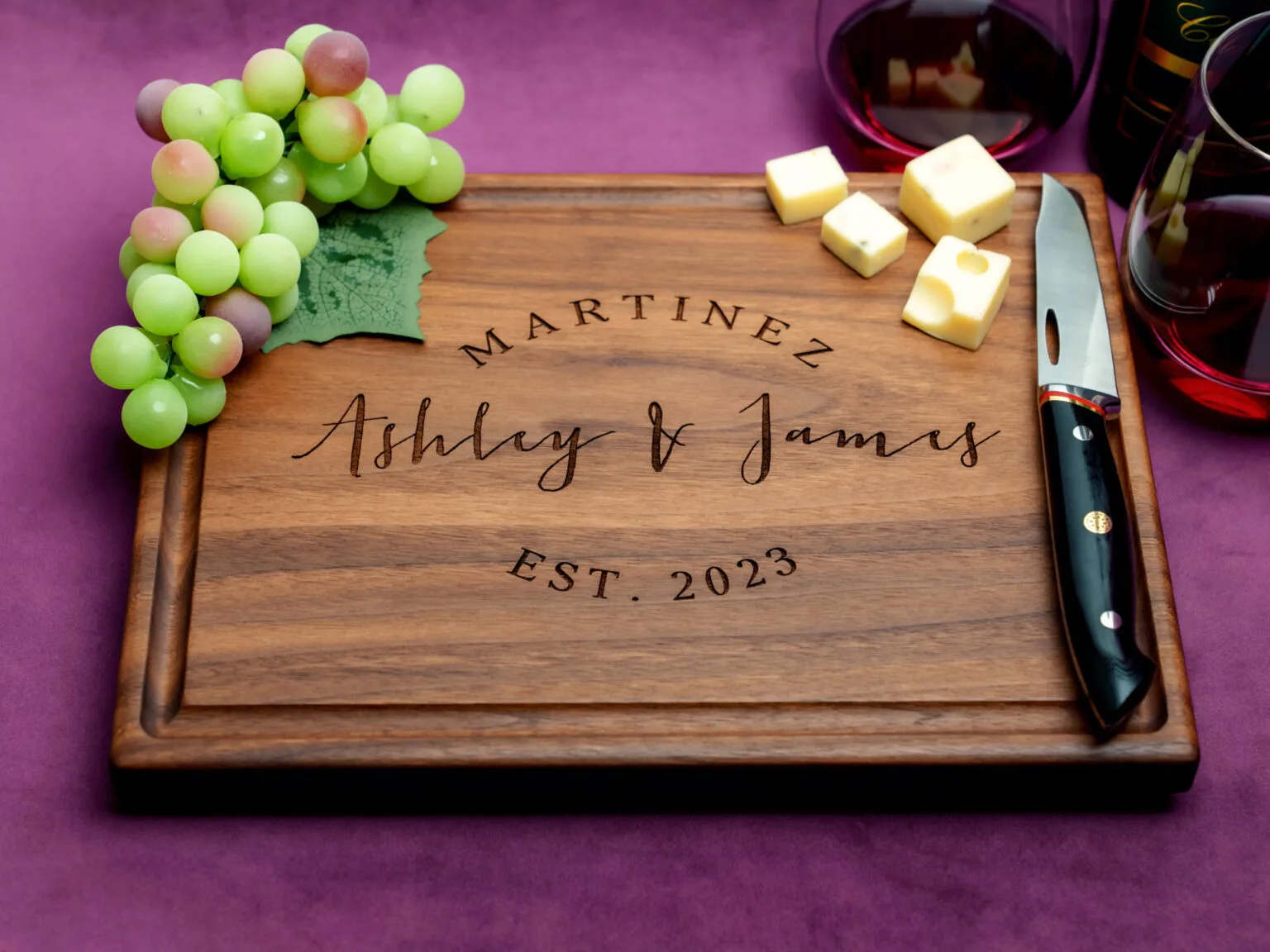 natural wooden board with round script design engraving on purple background