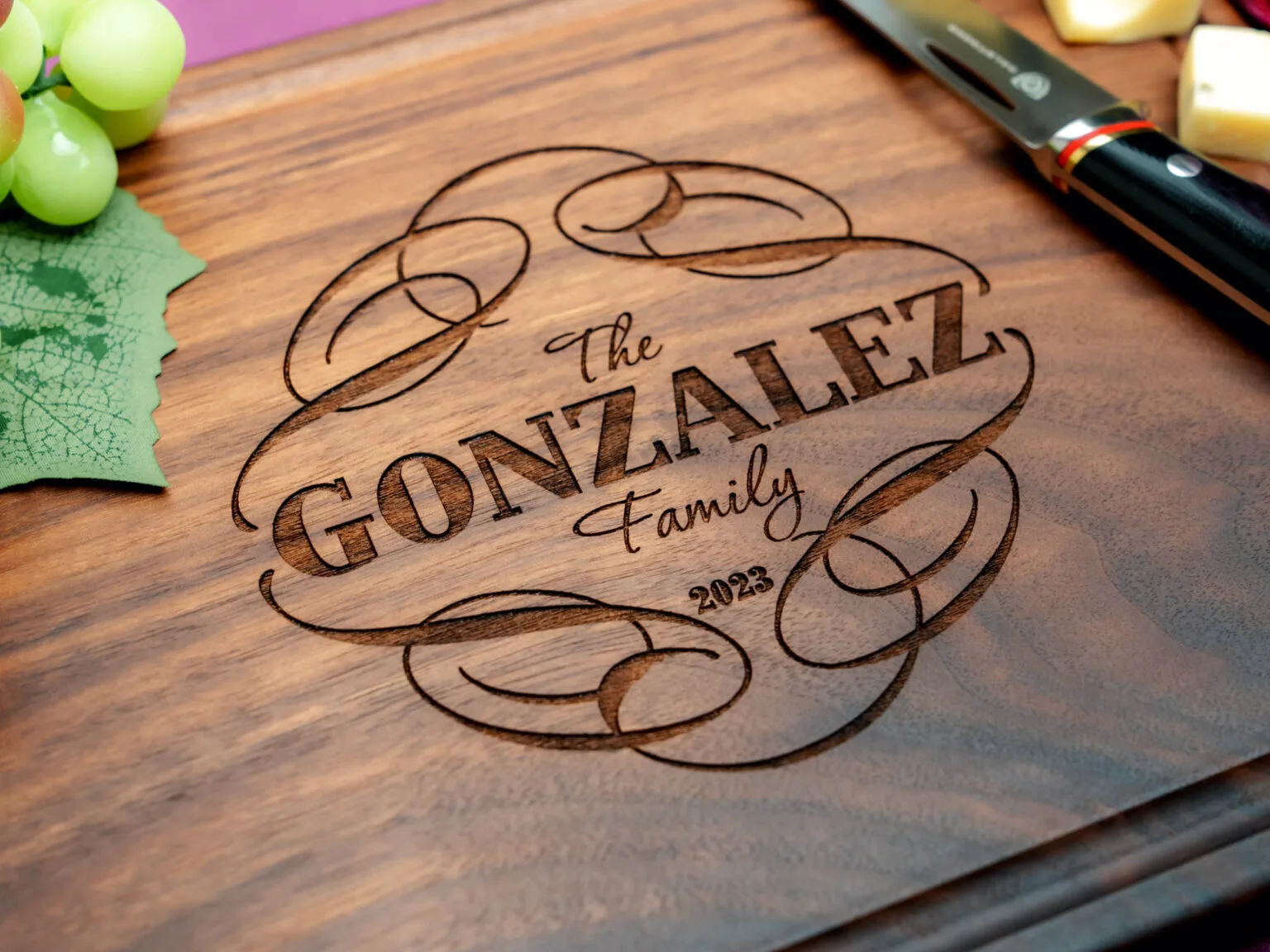 walnut cutting board engraved with family last name and date