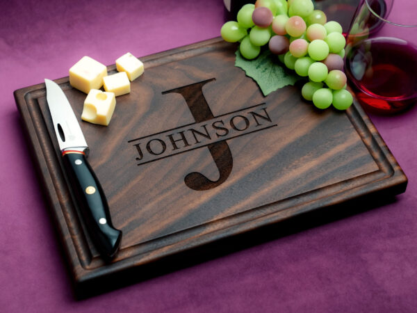 custom engraved walnut charcuterie board with grapes cheese knife and red wine