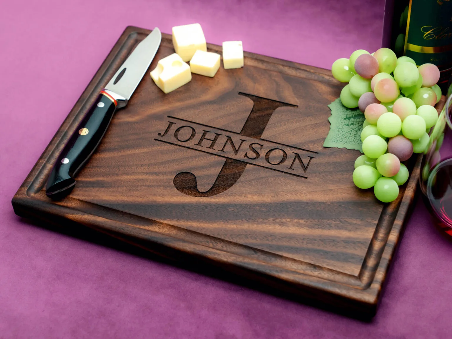 initial and last name personalization engraved on wooden cutting board