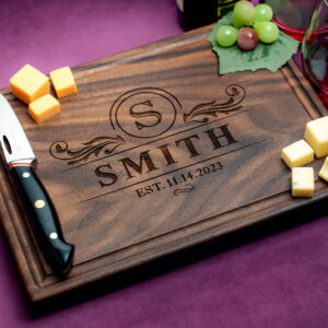 personalized natural hardwood walnut board with green grapes cheese and two glasses of red wine