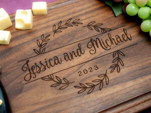 walnut board engraved with wreath design with couple's first names and date