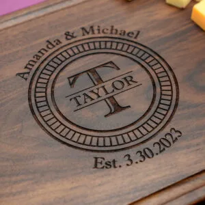 Engraved charcuterie with Initial last name first names and wedding date