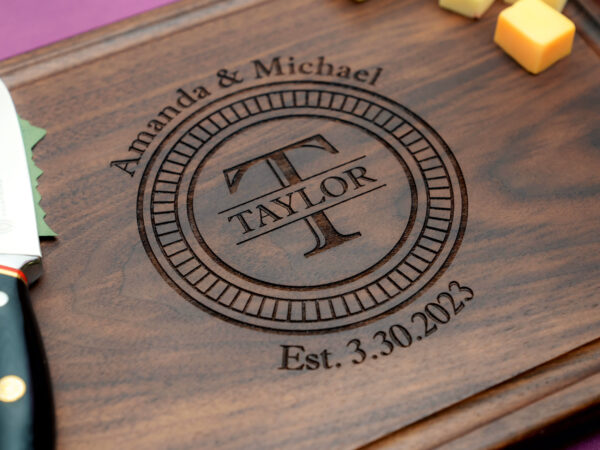 Engraved charcuterie with Initial last name first names and wedding date