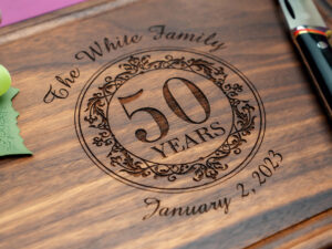 Parents' wedding anniversary engraved on cutting board with yeas together date and family name