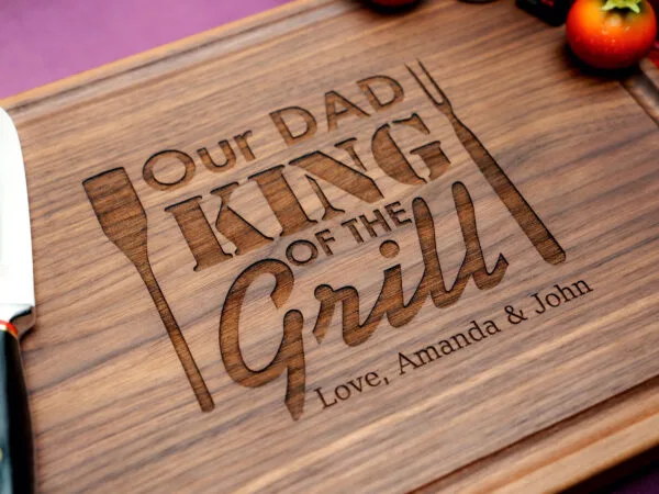 wooden cutting board featuring the phrase "Dad, King of the Grill" perfect for barbecue enthusiasts and proud fathers