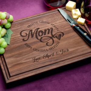 A custom walnut cutting board with a juice groove, showcasing a unique and personalized design. Celebrate your mom's best qualities with this thoughtful and practical gift, highlighting her strengths and virtues in a beautiful and lasting way