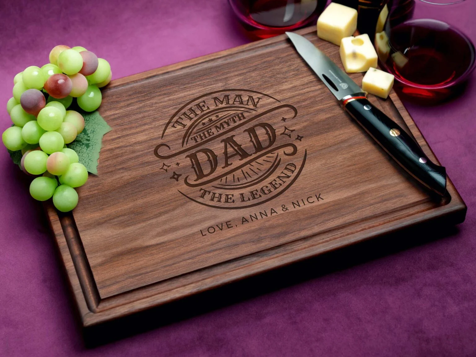 A walnut cutting board with a juice groove, showcasing the phrase 'DAD: The Man, The Myth, The Legend' engraved in elegant script, celebrating fatherhood with timeless craftsmanship and practical design.