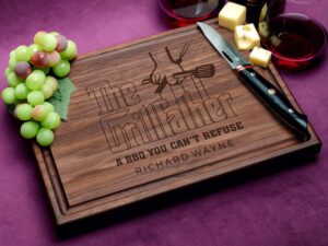 Elevate your gifting with our custom walnut cutting board, complete with a practical juice groove and The GrillFather motif. This board not only promises durability and functionality but also adds a touch of elegance to any kitchen. Ideal for Father's Day and beyond, it's a thoughtful choice that merges style with utility, perfect for showcasing culinary skills and creating lasting memories.