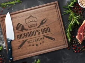 Elevate any occasion with our personalized walnut cutting board featuring a Grill Master design and convenient juice groove. Ideal for BBQ lovers, it combines durability with stylish design. Crafted from premium walnut, it boasts natural antibacterial properties for a clean kitchen. Perfect for showcasing grilling skills or as a thoughtful gift, this board suits various occasions, making it a versatile addition to any chef's toolkit.