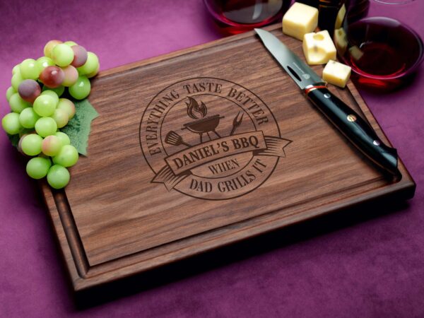 Transform meal prep with our personalized walnut cutting board showcasing an 'Everything Tastes Better When Dad Grills It' design and practical juice groove. Crafted for BBQ aficionados and Father's Day gifting, it blends elegance with functionality. The premium walnut wood offers natural antibacterial benefits, ensuring a clean cooking area. Whether for displaying grilling expertise or as a heartfelt gift, this board delivers style and utility, making it an essential kitchen accessory.