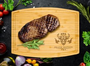 Transform your cooking space with our arched bamboo cutting board, personalized with a BBQ design and eye-catching bull motif. Featuring a handy juice groove, it's the perfect canvas for displaying fresh steak, vibrant vegetables, and aromatic spices during your next grilling session.