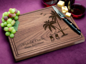 Engraved cutting board with a tropical vibe and 'Happy Retirement' message