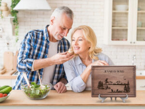 Happy retired couple cooking together in the kitchen