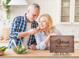 Retirement man and woman in the kitchen tasting food personalized gift on display