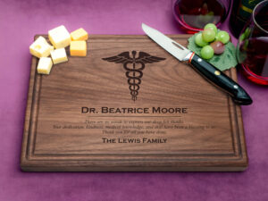 natural wooden plaque with caduceus medical symbol on purple background