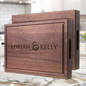 handmade walnut chopping block with handles engraved with first names and date unique gift for newlyweds or wedding