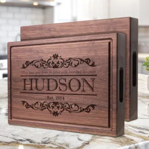 walnut hardwood chopping block with handles engraved with quote design family's last name and date perfect gift for couples anniversary or newlyweds