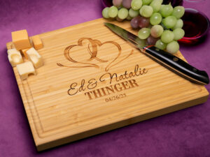 Personalized Bamboo cutting board engraved with couples' names for housewarming or engagement party