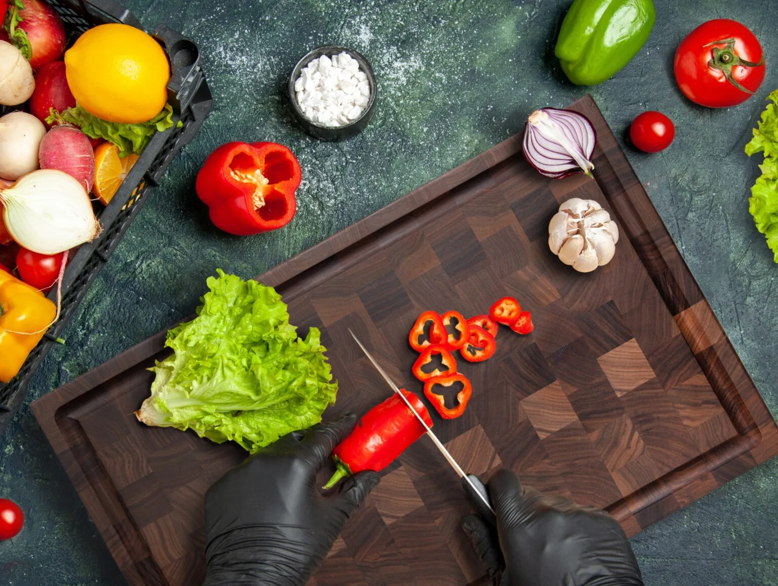 dicing chili peppers on extra large walnut end grain block